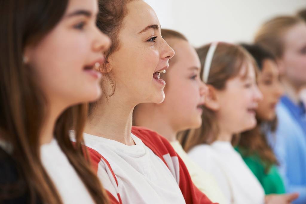 Young singers exercising vocals